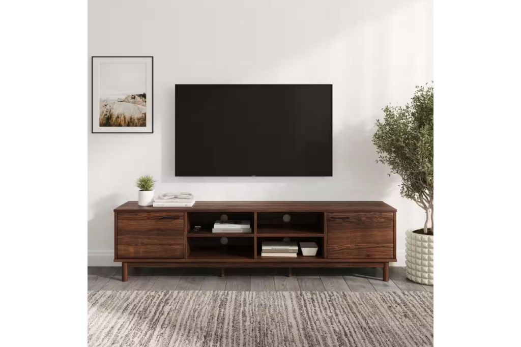 A TV console and TV in a living room.