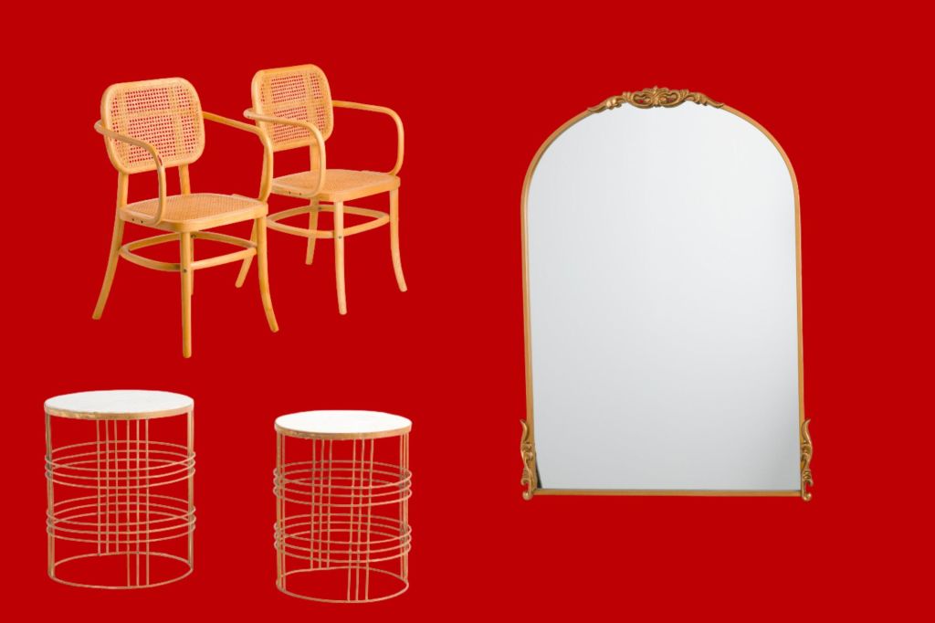 Two chairs, two side tables and a large gold mirror.