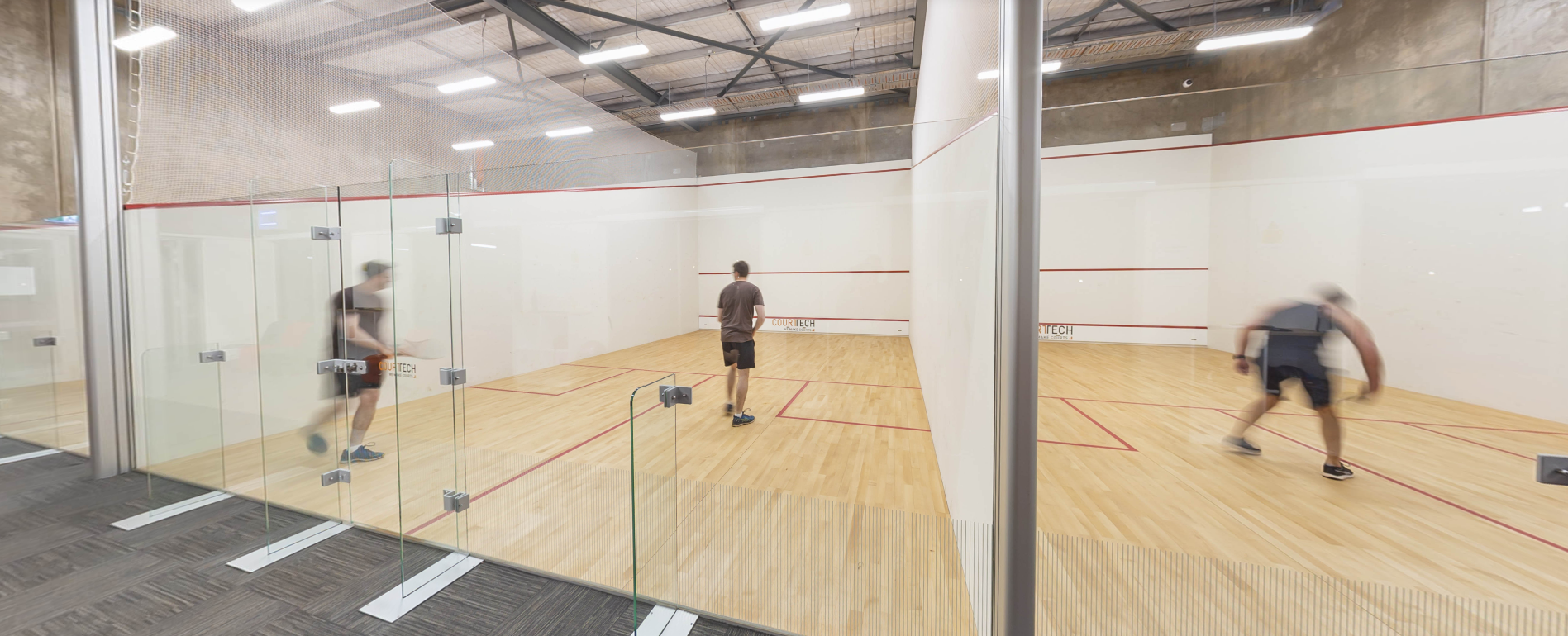 Mining workers playing squash inside the facility