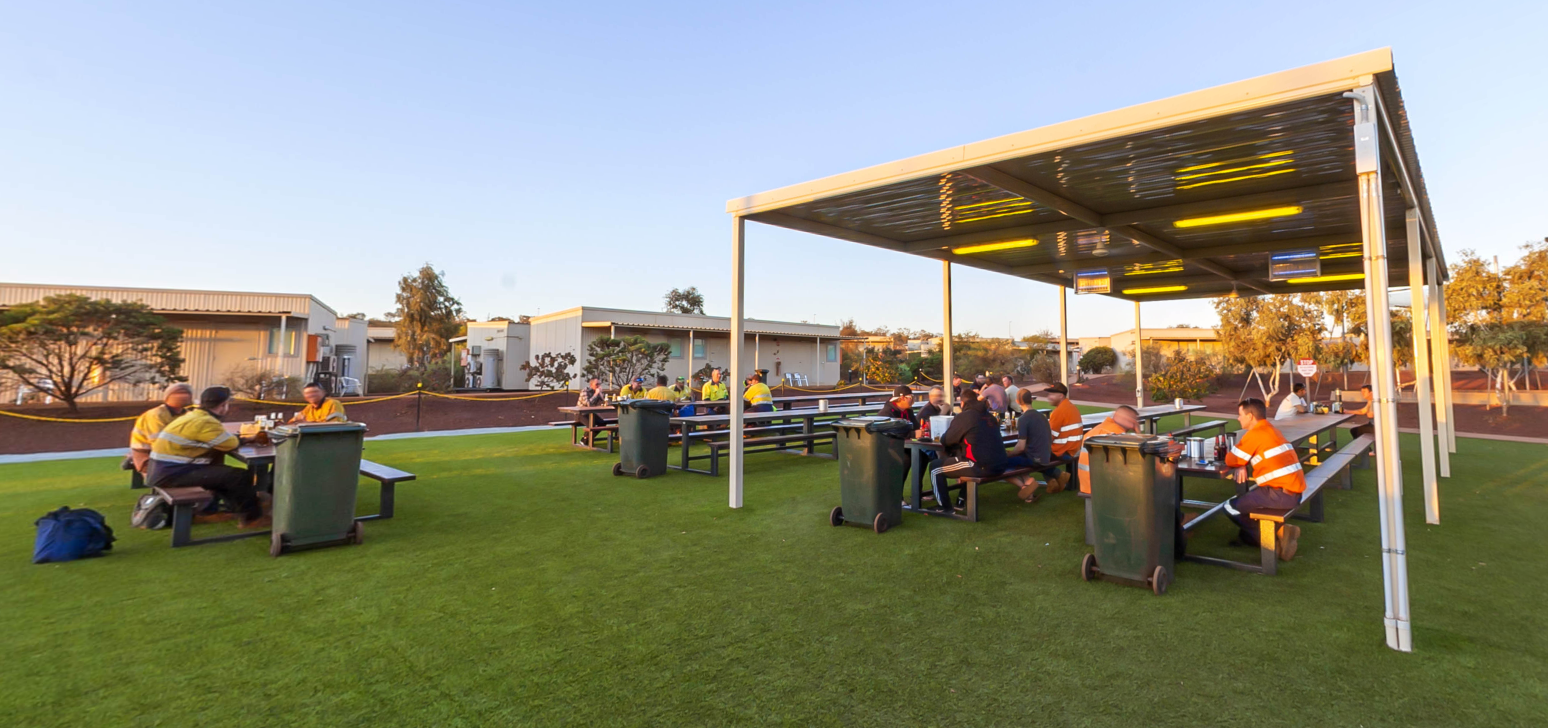 Miners having drinks at the camp's rooftop bar